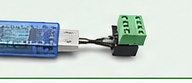 A blue USB-to-RS485 converter with a green screw terminal
